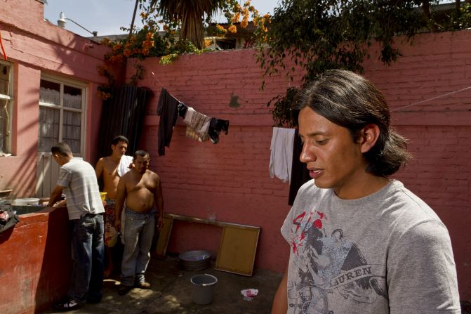 Church officials say more than 100 Central American immigrants pass through the Lecheria neighborhood daily. Neighbors called for this shelter housing them to shut down.