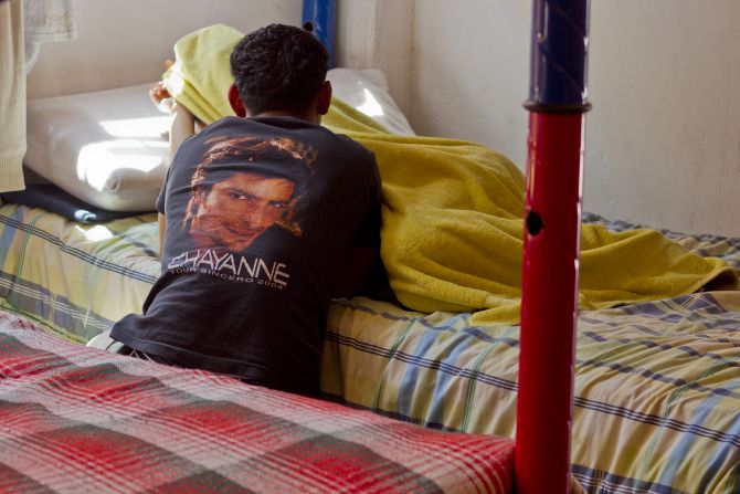 An immigrant couple rests at the shelter, which closed this week after growing conflicts with the neighbors.