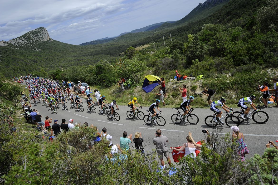 Fans cheer on cyclists participating in the 2012 Tour de France on Saturday, July 14. 