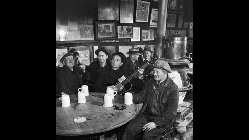 In 1943, when these photos were taken in New York City, Woody Guthrie was still relatively unknown outside of musical circles, but his semi-fictionalized biography, "Bound for Glory," would soon introduce him to a wider audience, and in the coming years his influence on folk and protest music would become profound. This photo was taken at McSorley's Old Ale House, which still stands today in the East Village. Guthrie was born in Oklahoma on July 14, 1912. He died in New York in 1967 at age 55.  <br />