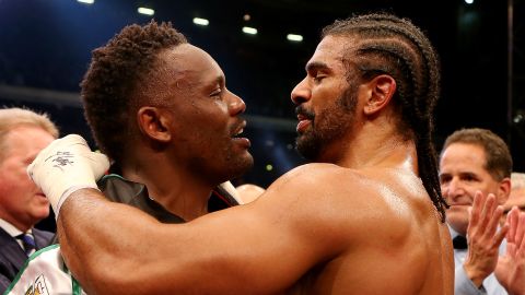 Best of friends? Dereck Chisora (left) and David Haye embrace after the grudge match at Upton Park in London