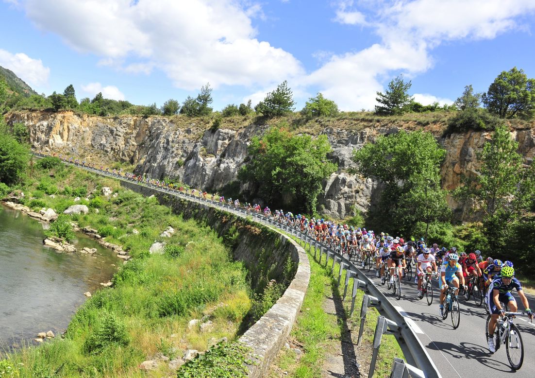Riders make their way around a bend during Sunday's stage, which is the first in the Pyrenees mountains.