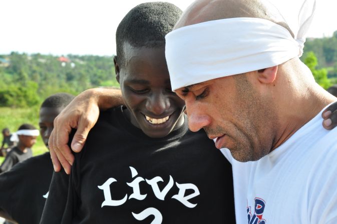 Legendary breaker Pervez (right) flew from the UK to Rwanda's capital Kigali, to help the center's children develop their dance skills. 