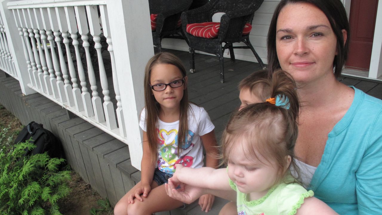 Amanda Sedgmer, with her kids in Hopedale, Ohio, worries about the survival of the coal industry and her family's way of life.