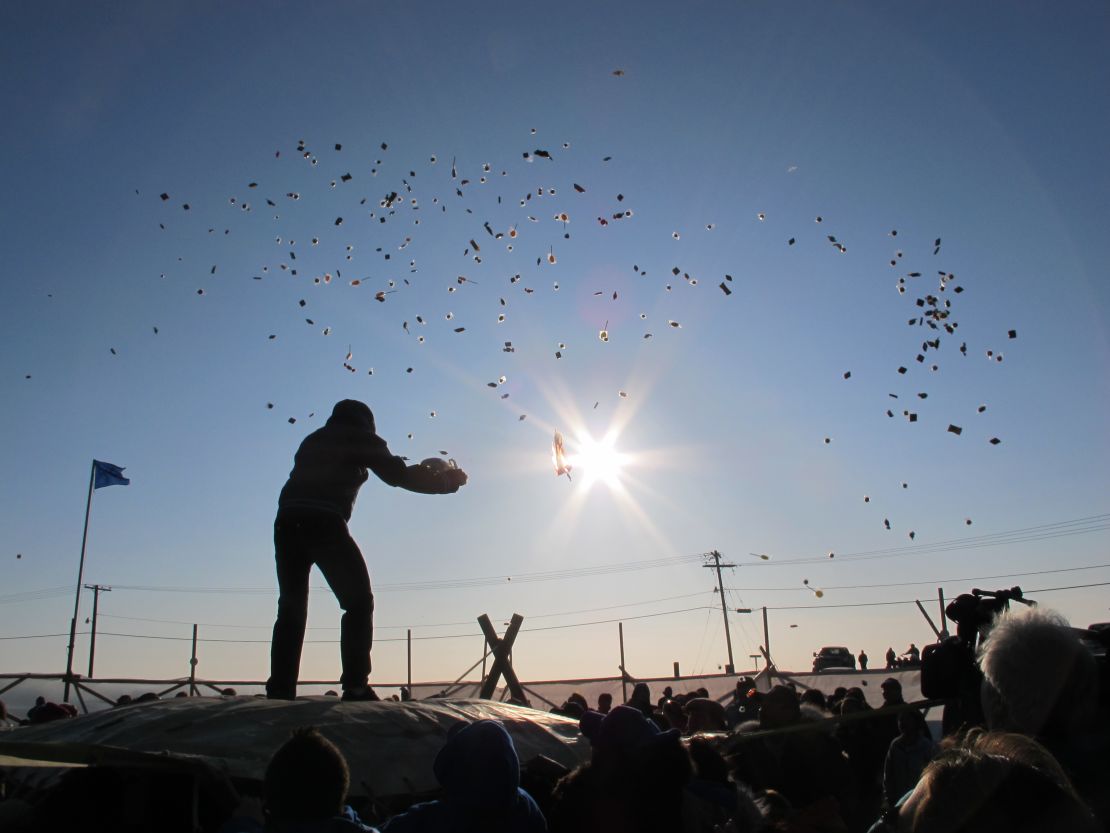 Barrow, Alaska, residents enjoy a traditional blanket toss. The community is wrestling with the idea of proposed off-shore oil rigs. 