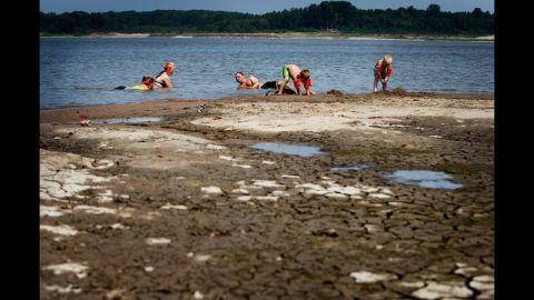 Swimmers relax in the shallow waters of the Mississippi River at Meeman-Shelby Forest State Park in Tennessee on July 6. Drought conditions have lowered the river's levels considerably from this time last year.