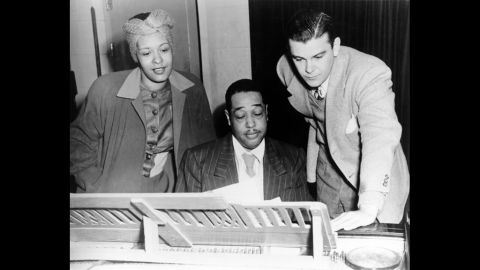 Jazz singer Billie Holiday, left, and composer Duke Ellington, center, rehearse "Symphony in Black: A Rhapsody of Negro Life" in 1935. Fans and artists are celebrating Lady Day, as she was known, on the 100th anniversary of her birth on April 7, 1915.