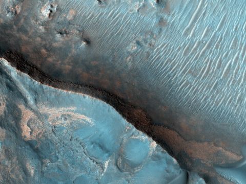 The Nili Fossae region of Mars is one of the largest exposures of clay minerals discovered by the OMEGA spectrometer on Mars Express Orbiter. This image was taken in 2007 as part of a campaign to examine more than two dozen potential landing sites for NASA's new Mars rover, Curiosity, also known as the NASA Mars Science Laboratory.