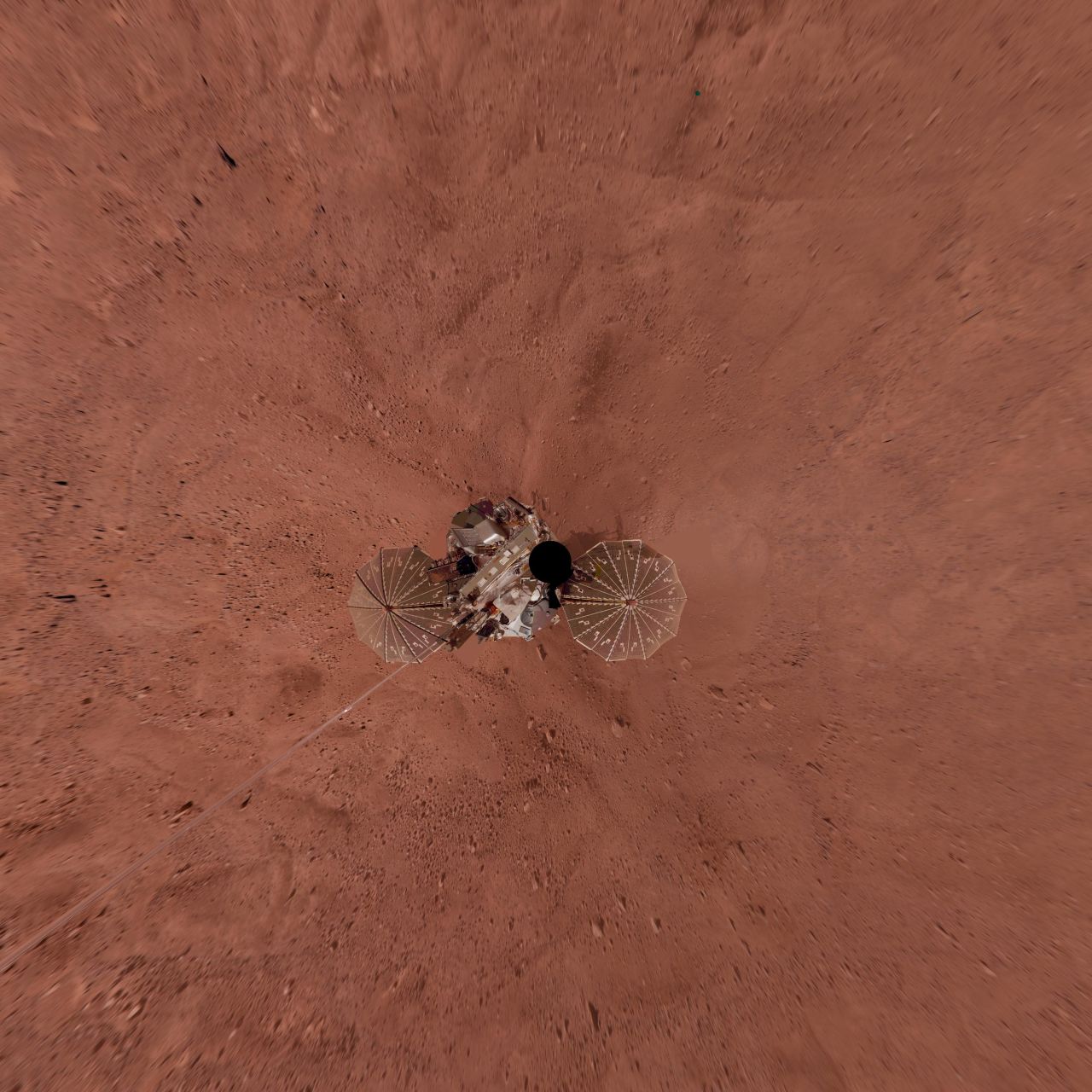 This view is a vertical projection that combines more than 500 exposures taken by Phoenix in 2008. The black circle on the spacecraft is where the camera itself is mounted.
