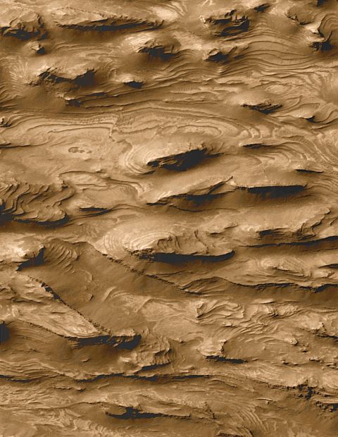 A photo captured by NASA's Mars Global Surveyor in 2000 offers evidence that the planet may have been a land of lakes in its earliest period, with layers of Earth-like sedimentary rock that could harbor the fossils of any ancient Martian life.