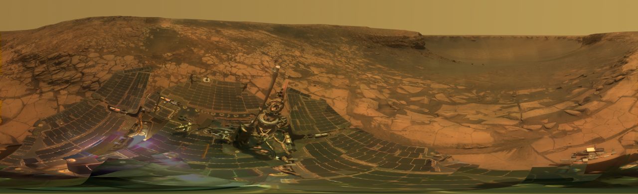 NASA's Opportunity examines rocks inside an alcove called Duck Bay in the western portion of the Victoria Crater in 2007.