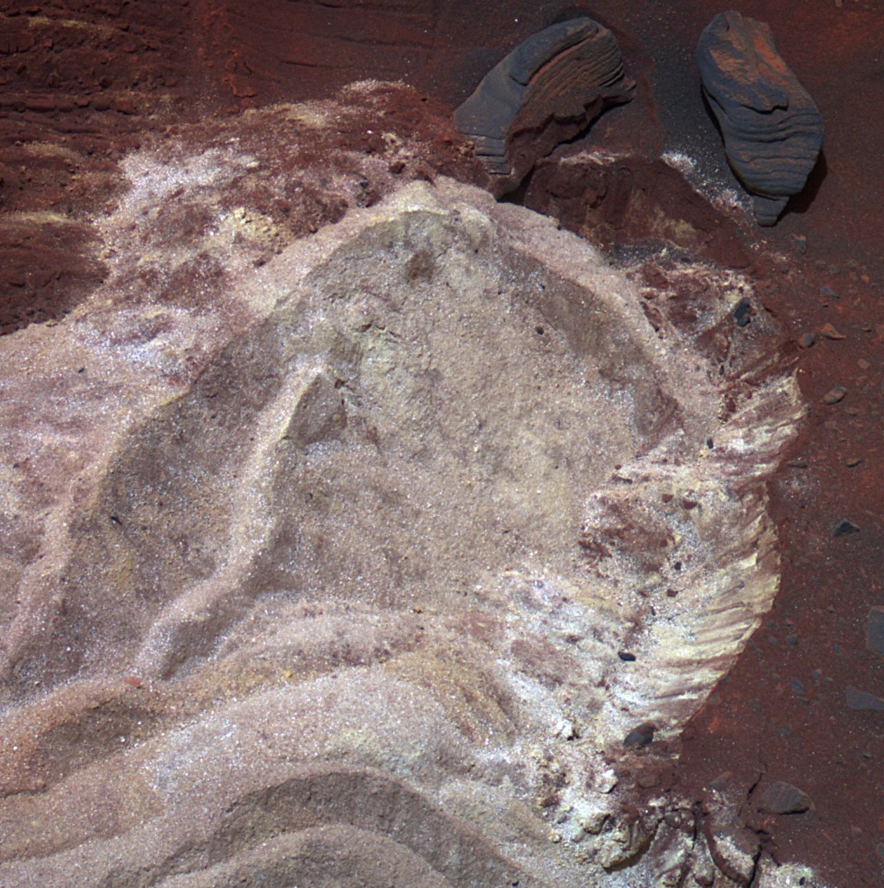 Soft soil is exposed when the wheels of NASA's Mars Exploration Rover Spirit dig into a patch of ground dubbed Troy in 2009.