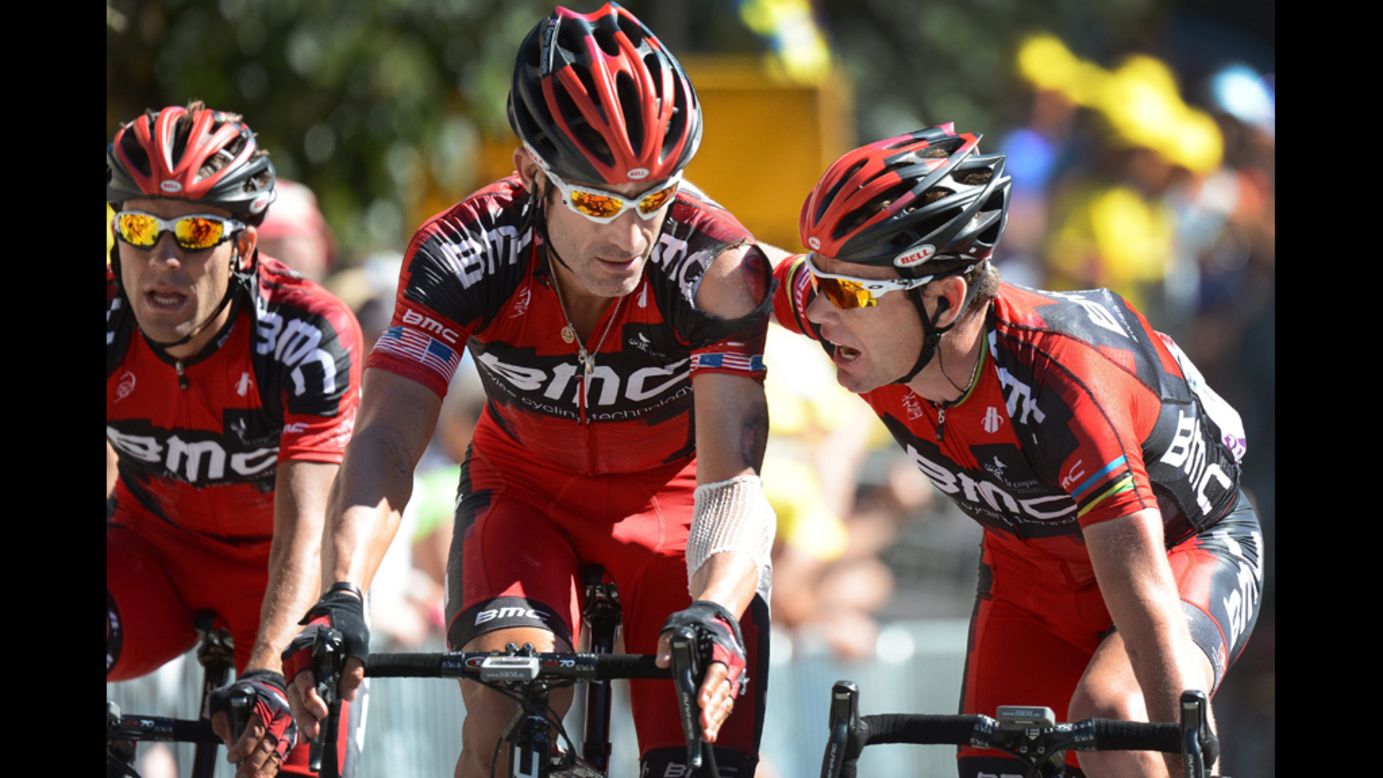 George Hincapie, of the United States and Cadel Evans of Australia on Team BMC talk during Wednesday's race.