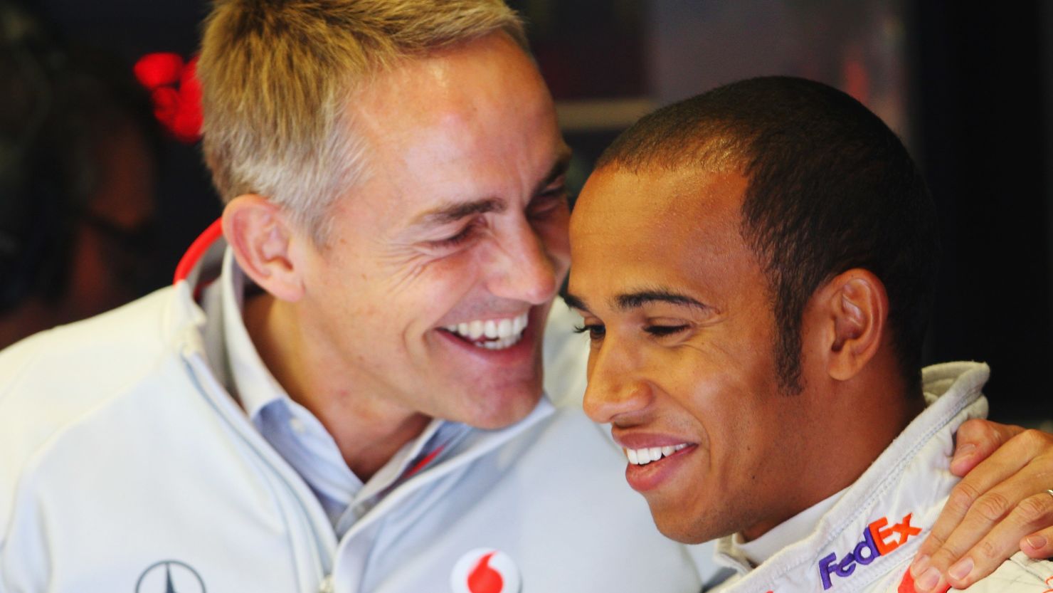 McLaren team boss Martin Whitmarsh (L) believes Lewis Hamilton will stay at the Formula One marque for a long time