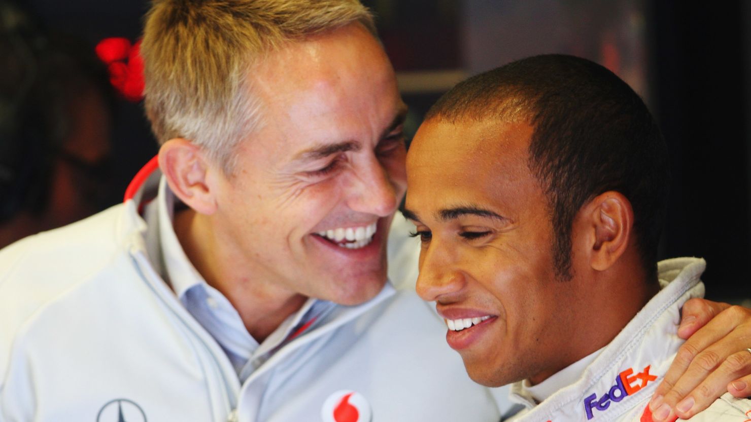 McLaren team boss Martin Whitmarsh (L) believes Lewis Hamilton will stay at the Formula One marque for a long time