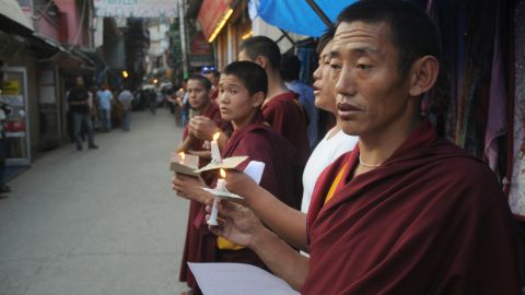 Exiled Tibetan monks chant prayers on June 15 after a man self-immolated in a Tibetan region of Qinghai province.