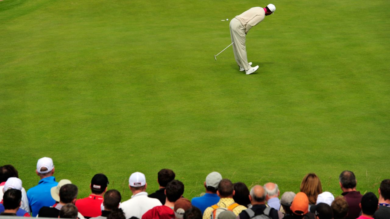 Woods reacts to missing a putt on the 13th green Thursday.