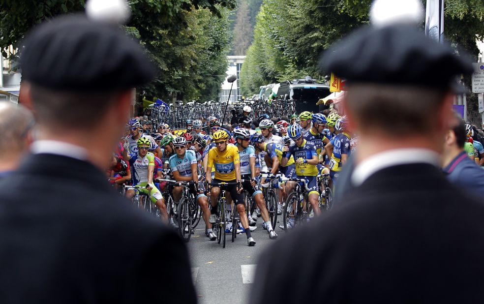 Tour de France riders wait before the start of the 17th stage of the race on Thursday.