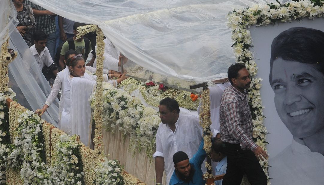 A float bearing the coffin of Rajesh Khanna is carried in a procession to the crematorium in Mumbai on Thursday, July 19.