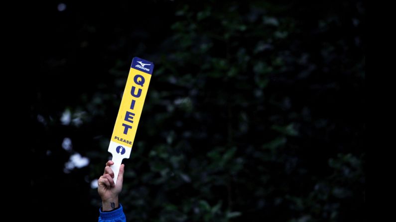 Fans receive the signal to remain silent during the first round Thursday.
