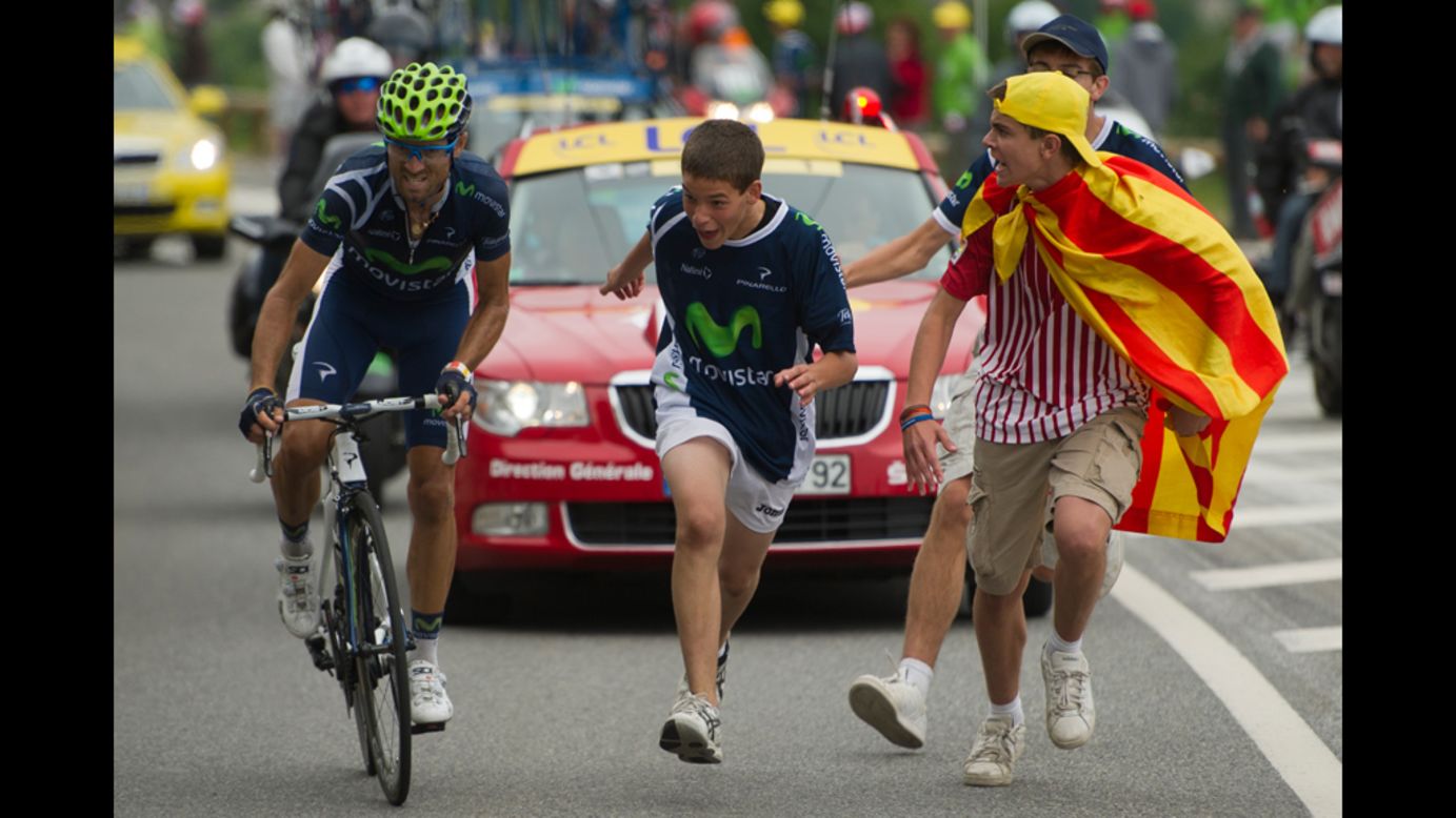 Spectators cheer on Spain's Alejandro Valverde as he rides to victory during the 143.5 kilometer (89 miles) Stage 17, starting in Bagneres-de-Luchon and finishing in the ski resort of Peyragudes, southern France, on Thursday, July 19. 