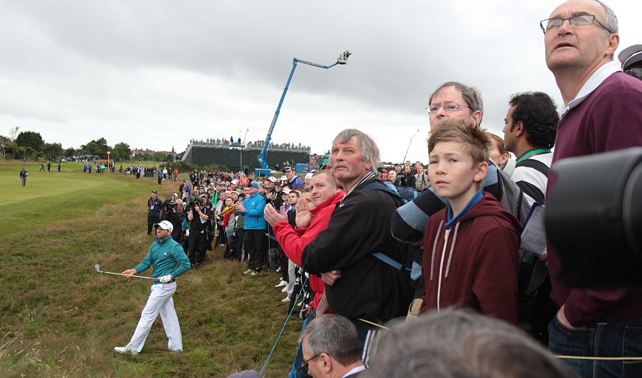 Spectators lean in to follow a shot out of the rough from Garcia on Thursday.