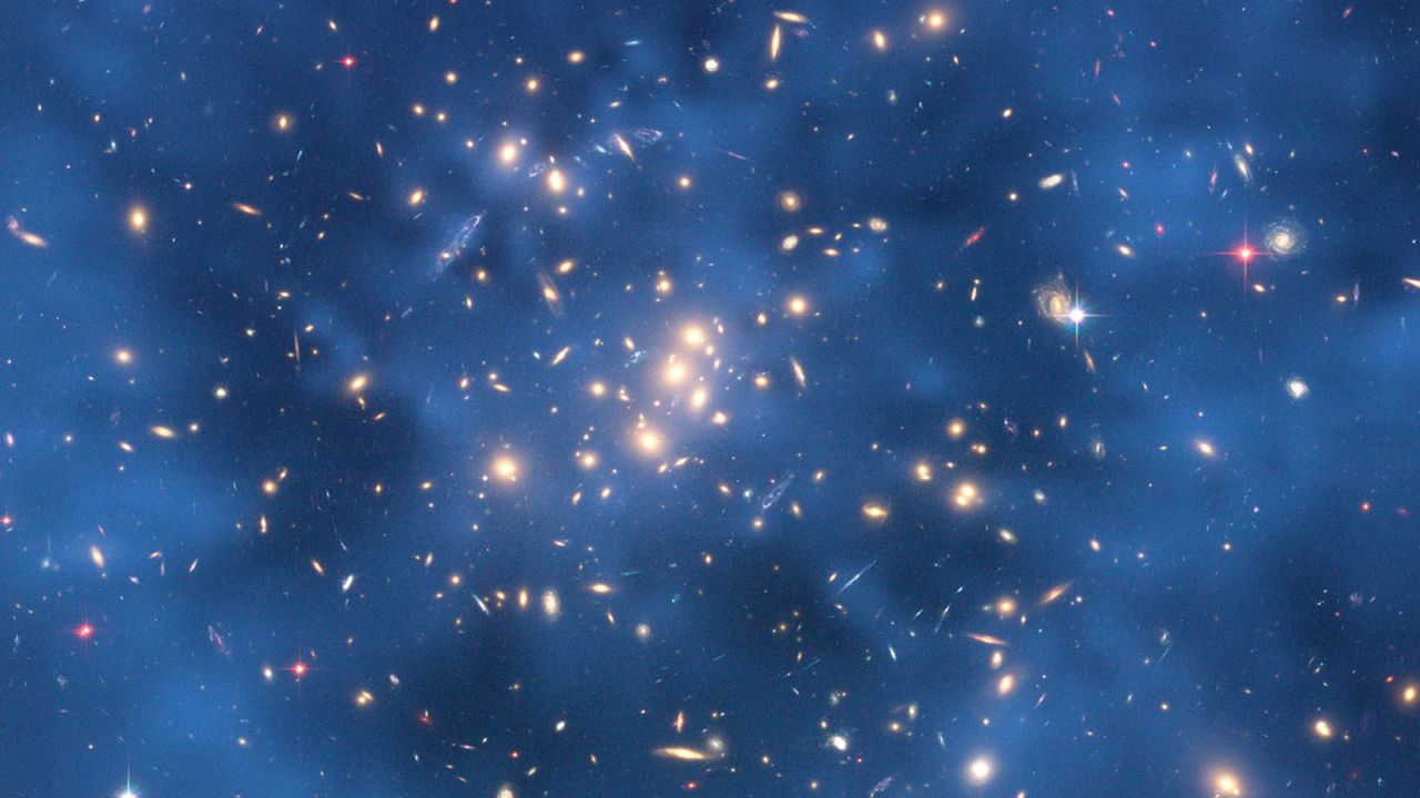 A Hubble Space Telescope image indicating a huge ring of dark matter around the center of the CL0024+17 cluster of galaxies.