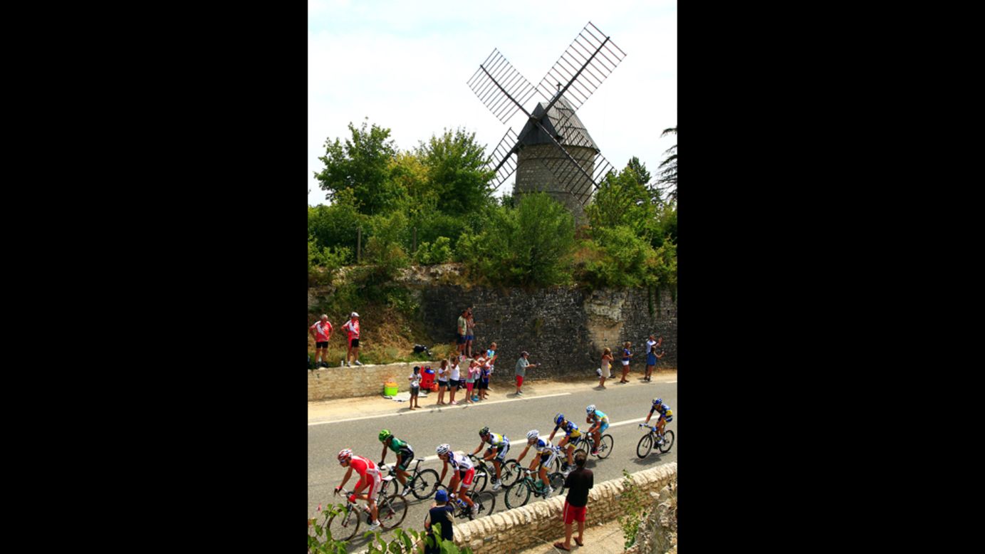 The leaders cruise past a windmill Friday on the 18th stage of the Tour de France. 