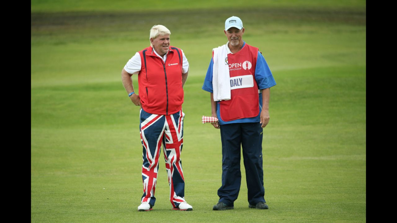 John Daly of the United States speaks with his caddy, Peter Van Der Riet, on the second fairway during Friday's second round.