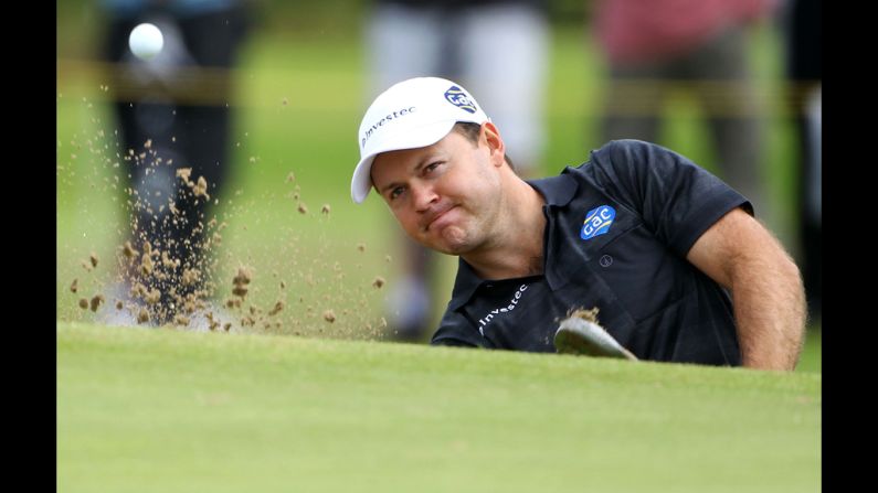 Richard Sterne of South Africa hits from a greenside bunker on the 11th hole during the second round Friday.