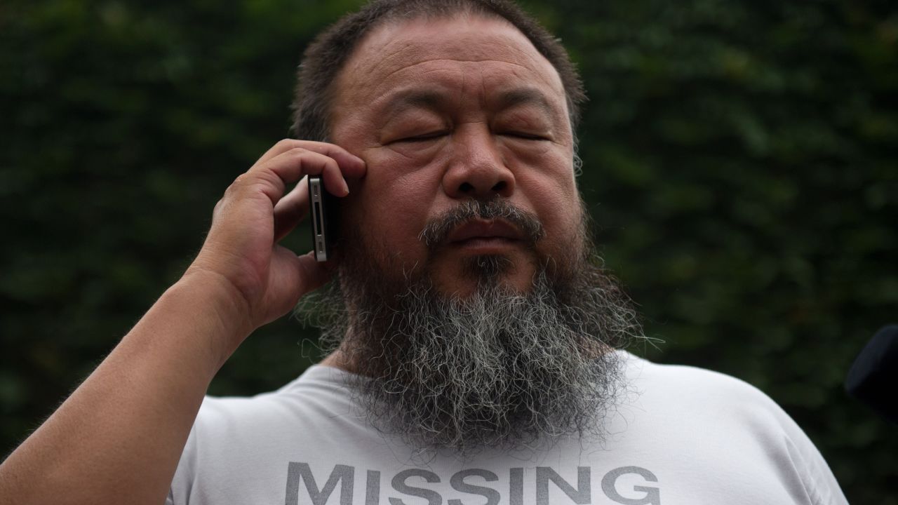 Ai Weiwei speaks to his lawyer from inside his compound in Beijing as the verdict of his court hearing is announced on July 20.