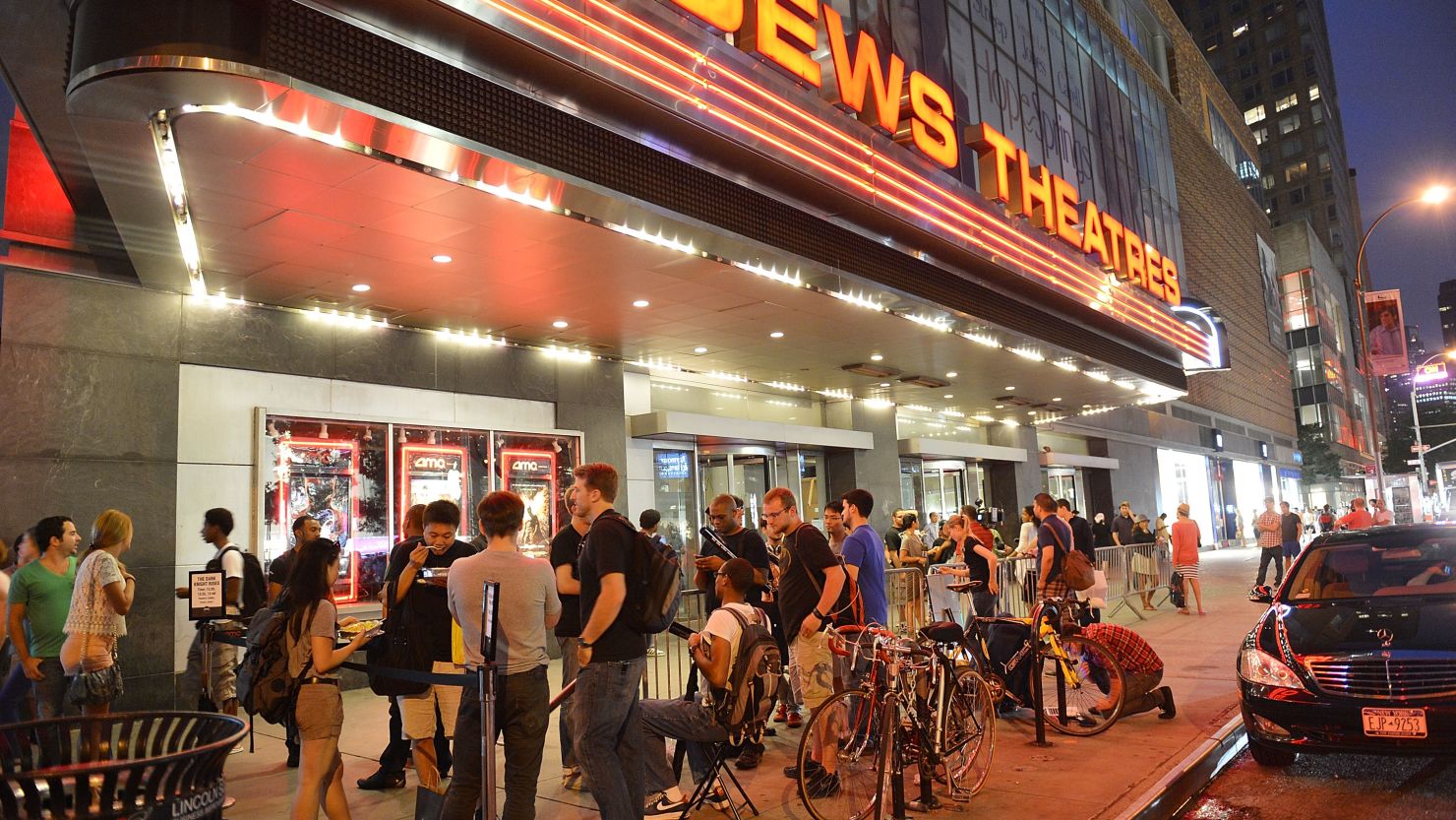 Fans wait outside for "The Dark Knight Rises" midnight premiere in New York.