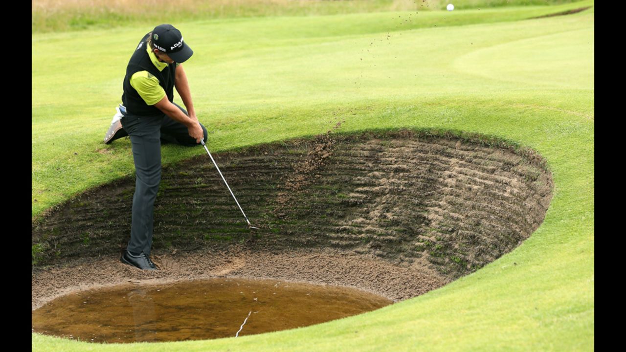 Aaron Baddeley of Australia plays a bunker shot on the fourth hole during the second round Friday.