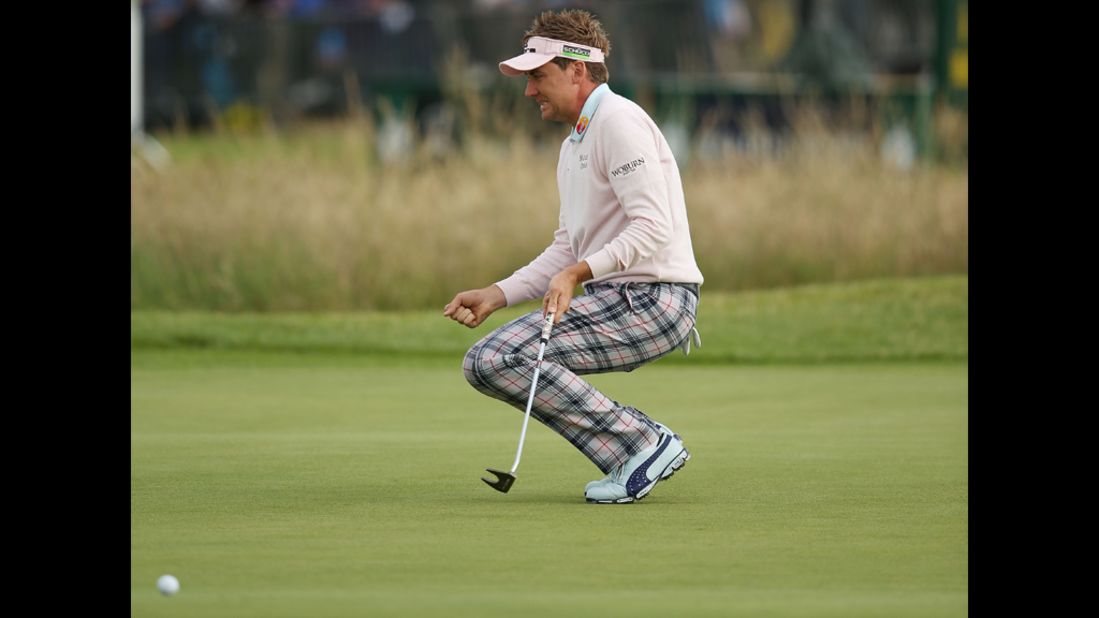 Ian Poulter of England reacts after missing a birdie putt on the 13th green Friday.