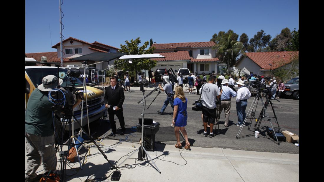 Television news crews gather in front of the home of Robert and Arlene Holmes, parents of suspect James Holmes, in San Diego on July 21, 2012.