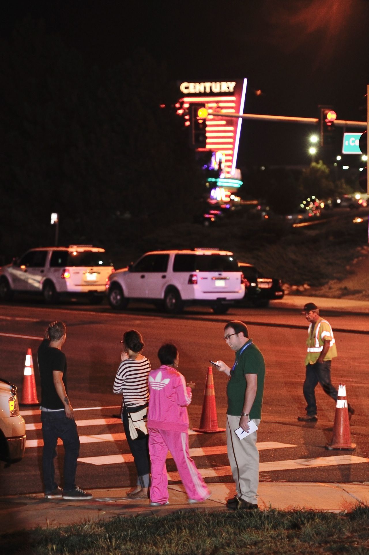 Onlookers gather outside the Century Aurora 16 theater.