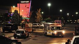 Image #: 18658861    epa03312099 An ambulance is parked outside the Century 16 Theater in the Town Center Mall in Aurora, Colorado, USA early 20 July 2012, after a gunman killed 14 people and wounded 50 in a shooting incident at the premiere of the latest Batman movie 'The Dark Knight Rises'.  EPA/BOB PEARSON /LANDOV