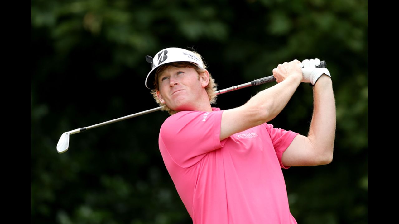 Snedeker hits his tee shot on the first hole Saturday.