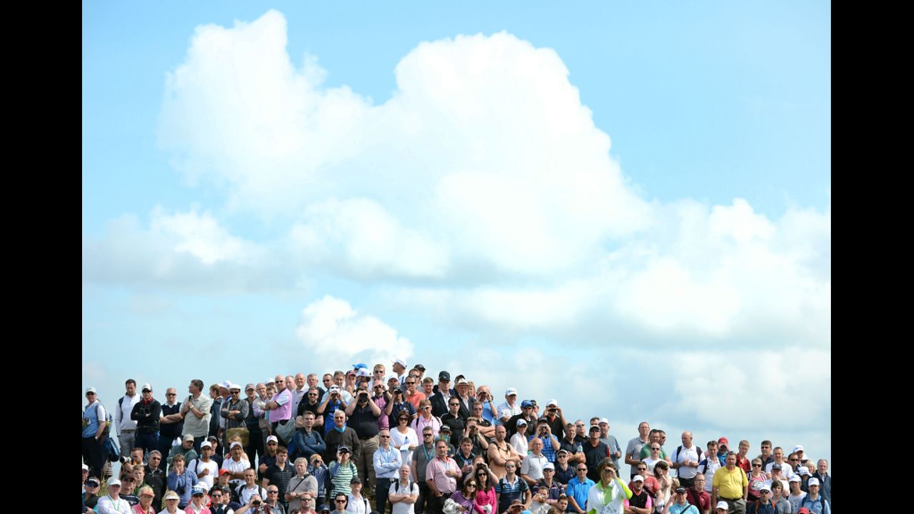 Spectators at the Open Championship enjoy Saturday's play in ideal golf weather.