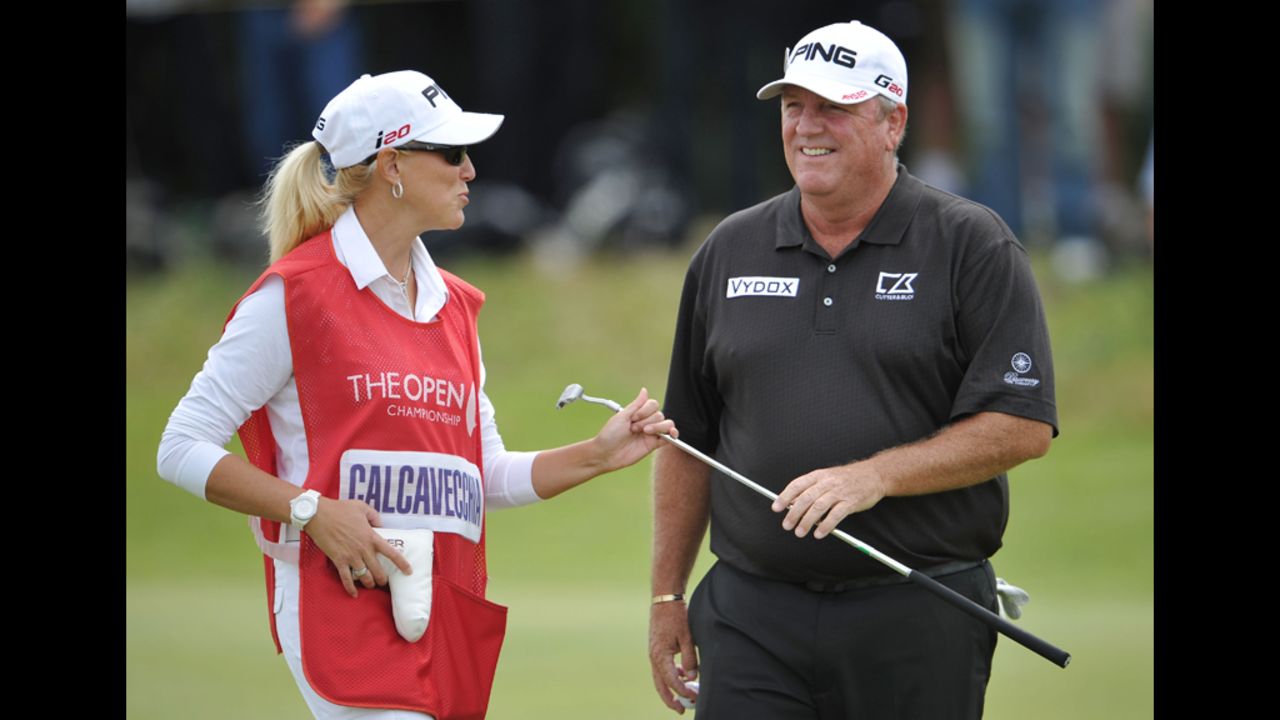 Mark Calcavecchia of the United States laughs with wife (and caddie) Brenda in the third round.