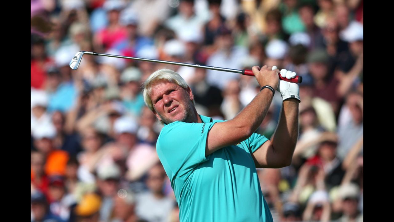 American John Daly swings at the fifth hole. Daly, who won the Open in 1995, struggled to a 77 Saturday and is in next-to-last place.