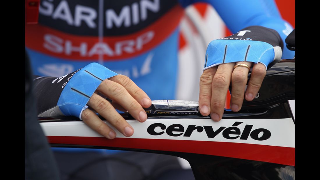 Briton David Millar tapes an energy gel to his top tube Saturday before stage 19.