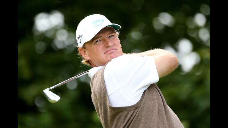 Ernie Els follows through on his swing at the first hole.