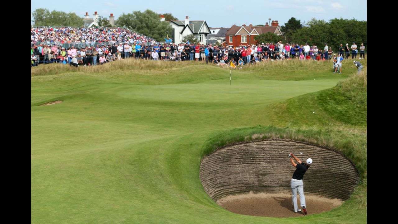Olesen hits a shot from a bunker on the seventh hole.