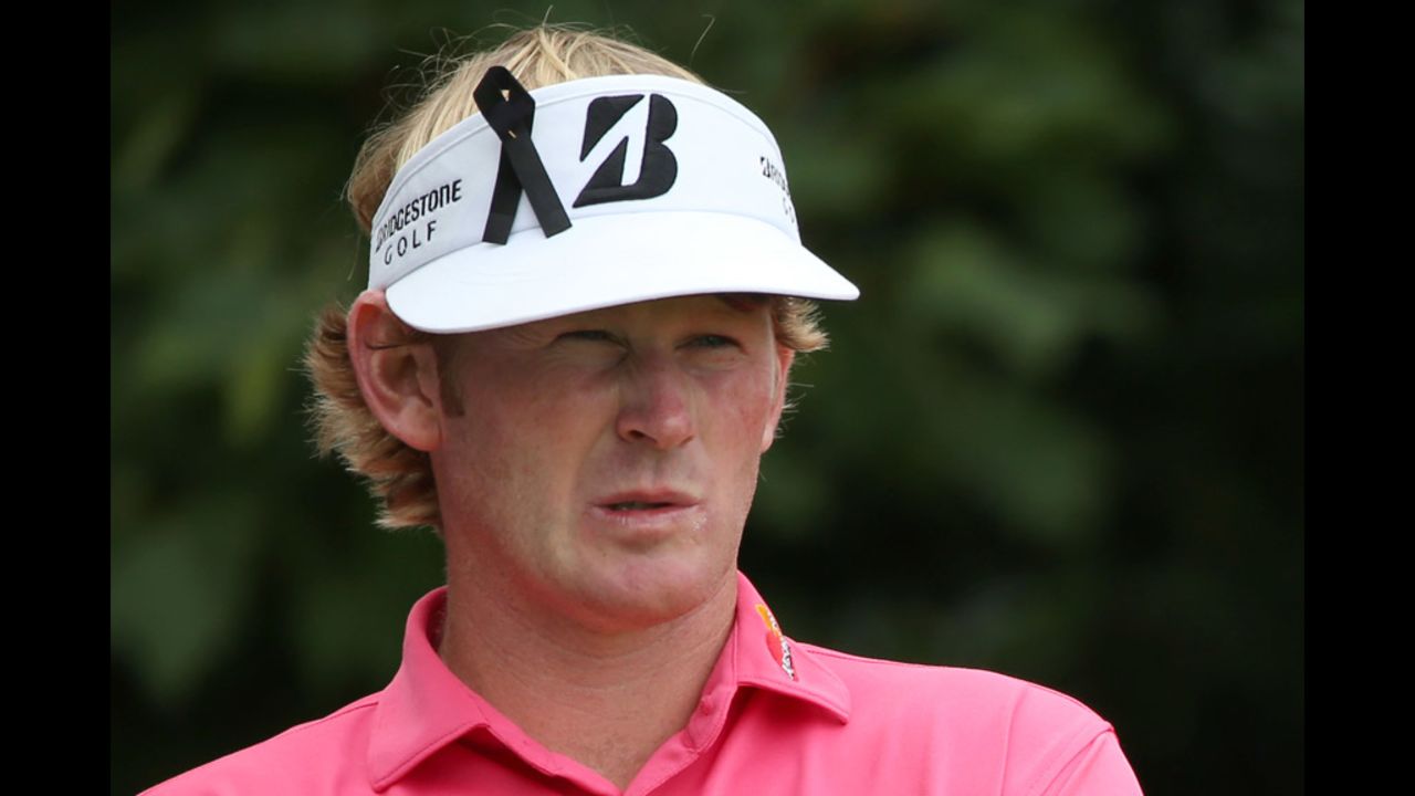 Brandt Snedeker of the United States wears a ribbon in sympathy for the Aurora, Colorado, shootings during the third round of the British Open on Saturday.