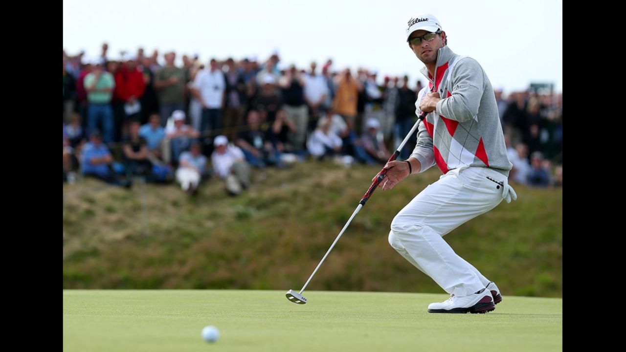 Adam Scott of Australia reacts to his putt on the sixth hole on Saturday.
