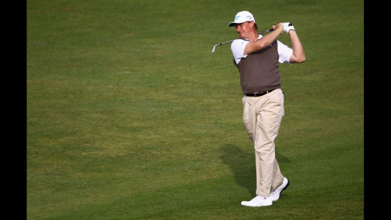 Ernie Els of South Africa hits an approach shot. Els, a three-time major champion, is tied for fifth place with American Zach Johnson, six shots out of the lead.
