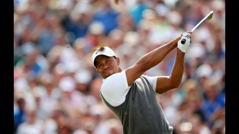 Woods follows through on his drive at the fifth.
