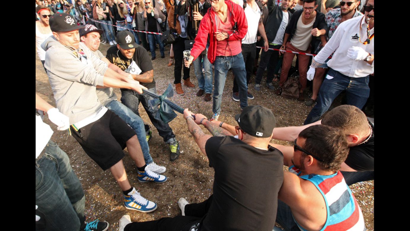Teams compete in the "Skinny Jeans Tug-O-War" event on Saturday.