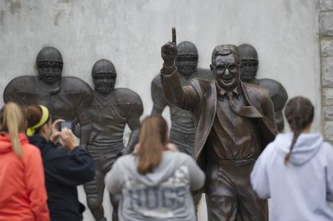 Visitors gather around the Paterno statue on Saturday, July 21.